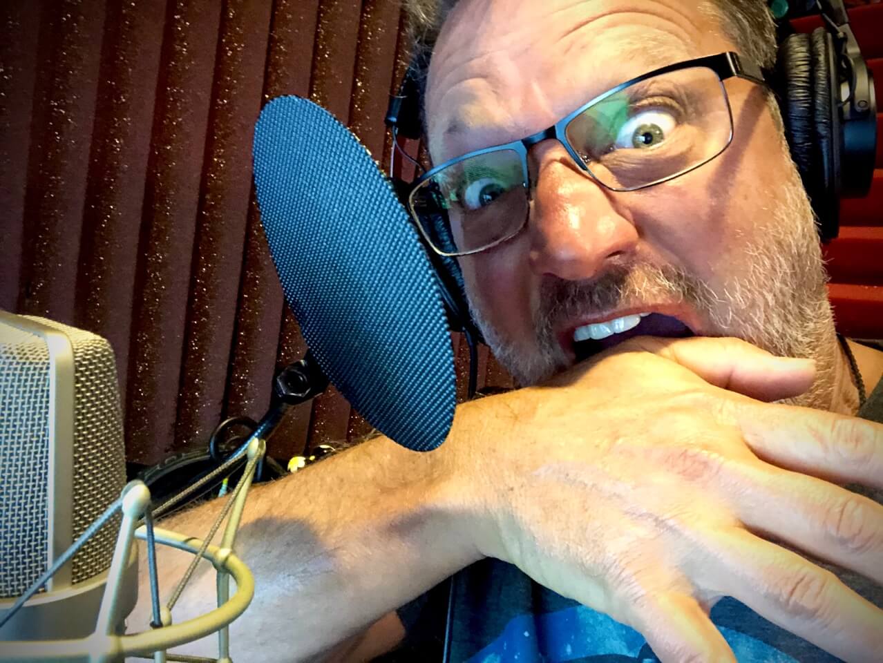 When Reality Bites- Image of Steve Blum biting his hand in the booth