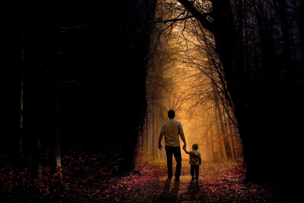 Dad and Son walking through Forest